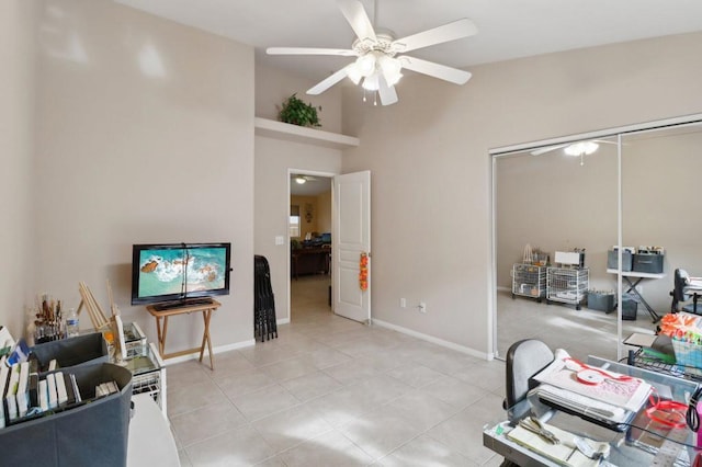 office area with ceiling fan, light tile patterned floors, and lofted ceiling