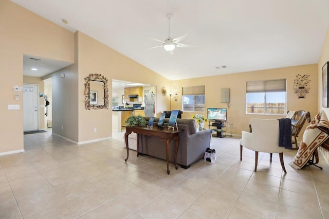 tiled living room with ceiling fan and lofted ceiling