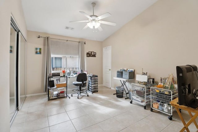 home office with ceiling fan, light tile patterned floors, and lofted ceiling