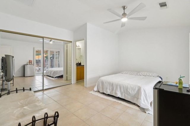 bedroom with ceiling fan, light tile patterned floors, and access to outside