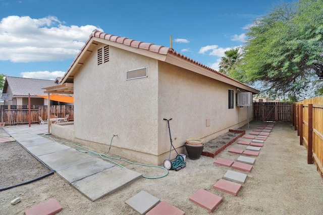 view of home's exterior with a patio area