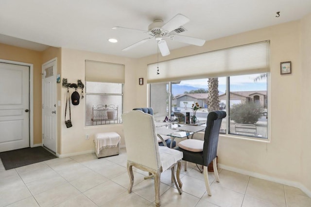 dining room with ceiling fan and light tile patterned floors