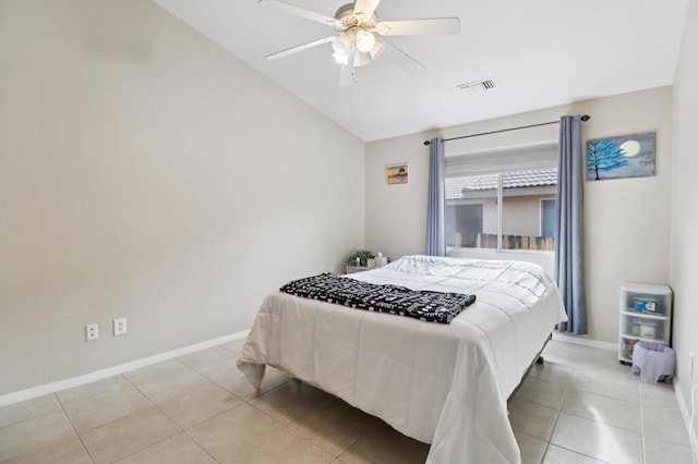 tiled bedroom with ceiling fan