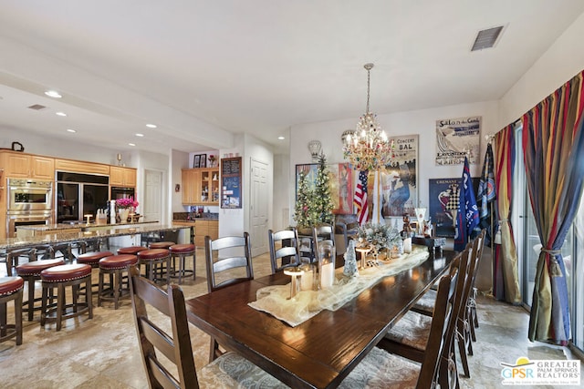 dining space with a notable chandelier