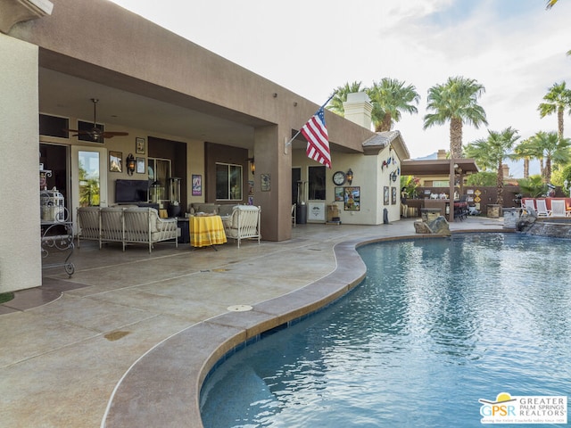 view of pool featuring ceiling fan, outdoor lounge area, and a patio