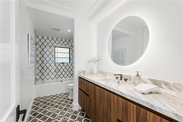 full bathroom featuring shower / bathing tub combination, vanity, and toilet