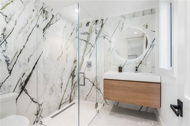 bathroom featuring tile walls, an enclosed shower, vanity, and toilet