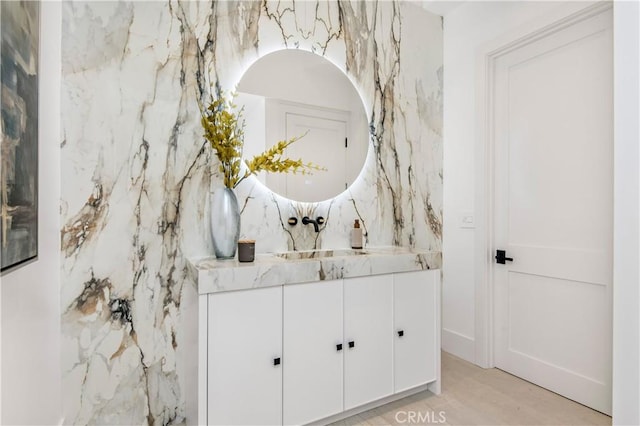 bathroom featuring hardwood / wood-style floors and vanity