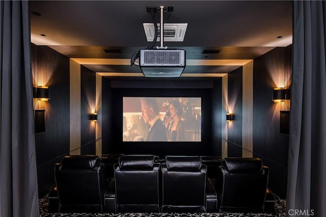 home theater room with wooden walls