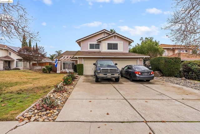 view of front facade with a garage and a front yard