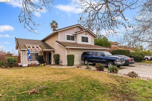 view of front of property featuring a garage and a front yard