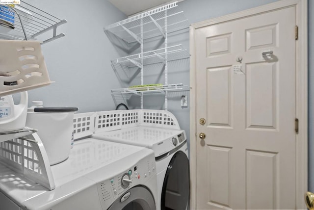 washroom with independent washer and dryer