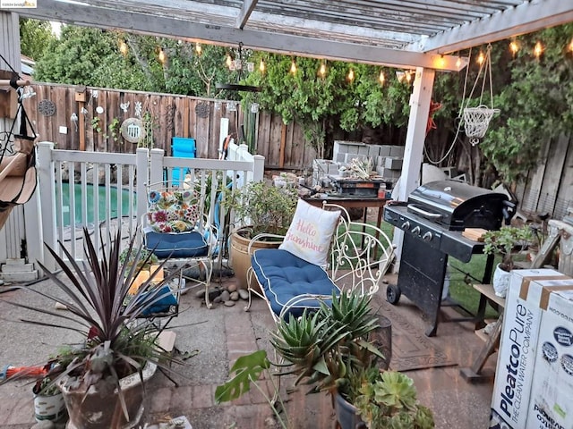 view of patio featuring grilling area and a pergola