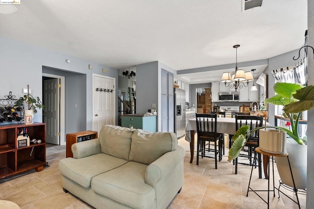 living room featuring a chandelier