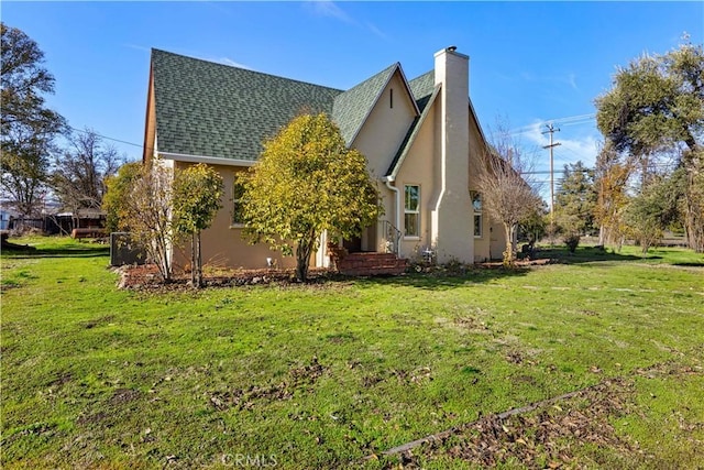 view of home's exterior featuring a yard