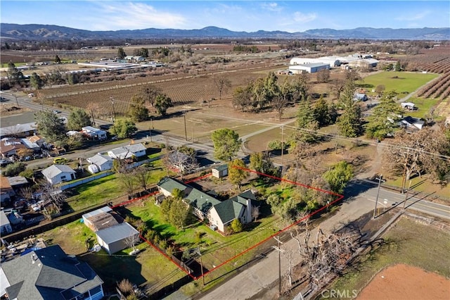 bird's eye view with a rural view and a mountain view