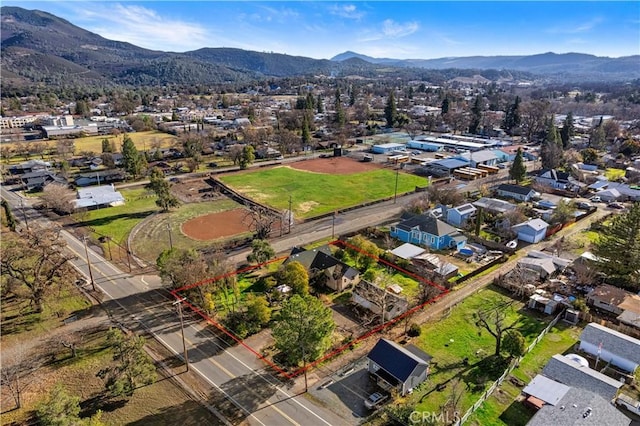 drone / aerial view featuring a mountain view