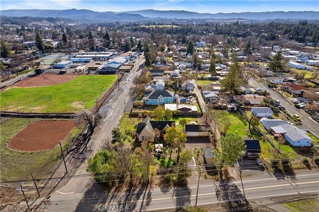 birds eye view of property with a mountain view