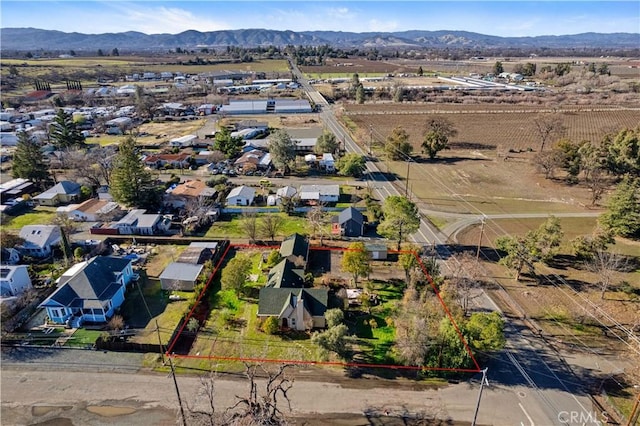 birds eye view of property with a mountain view