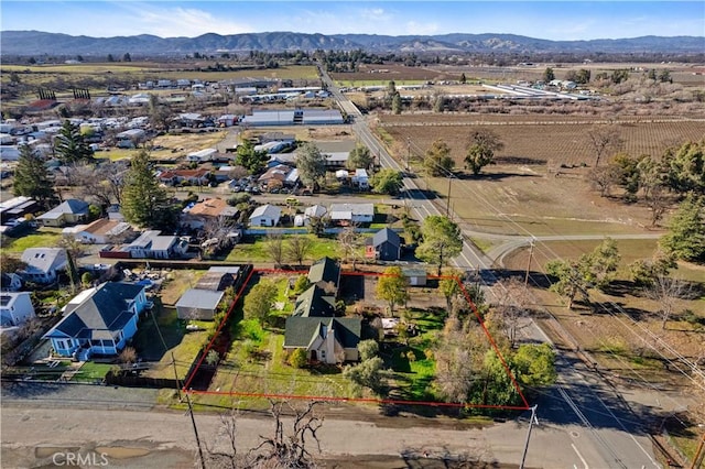 drone / aerial view featuring a mountain view