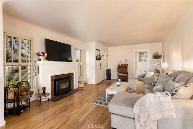 living room featuring a fireplace and light hardwood / wood-style flooring