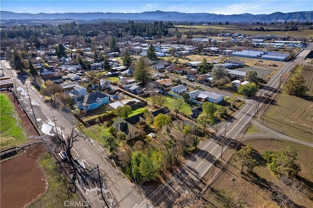 birds eye view of property featuring a mountain view