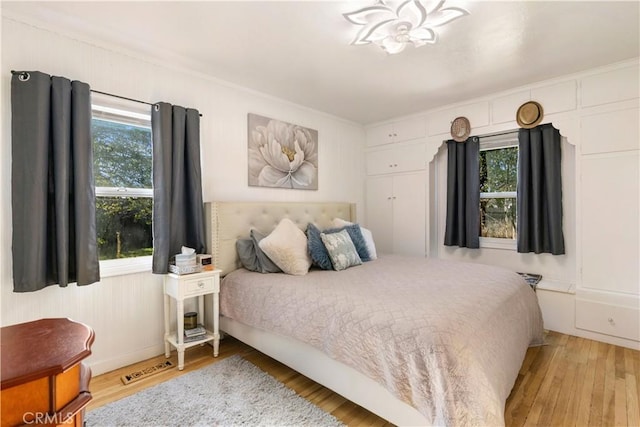 bedroom with visible vents and light wood-style floors