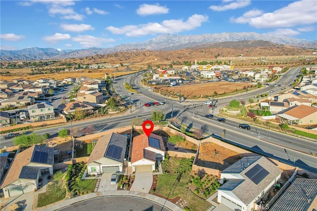 birds eye view of property with a mountain view