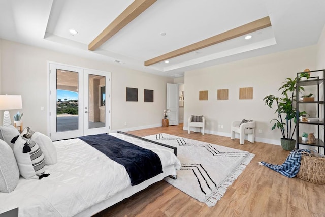 bedroom with access to outside, french doors, and hardwood / wood-style flooring