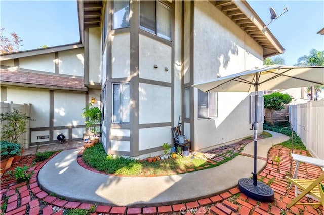 view of property exterior featuring a patio area