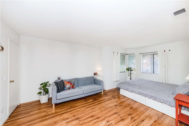 bedroom with light hardwood / wood-style floors