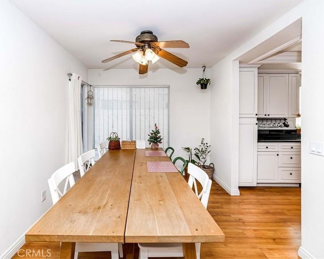 dining area featuring ceiling fan and light wood-type flooring