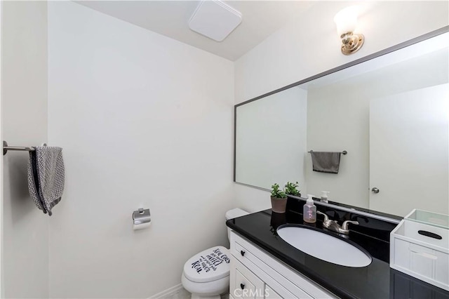 bathroom with vanity and toilet