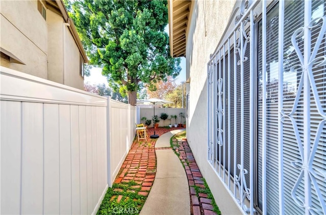 view of side of property with a patio