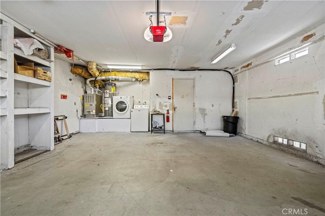 garage with a garage door opener, washer and dryer, and heating unit