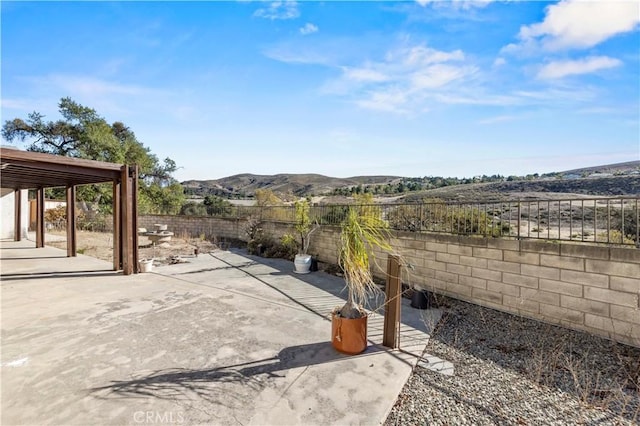 view of patio with a mountain view