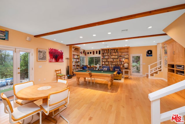 recreation room with beam ceiling, light wood-type flooring, built in features, french doors, and pool table