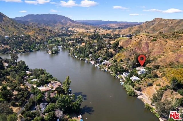 bird's eye view with a water and mountain view