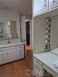 bathroom with hardwood / wood-style flooring and vanity