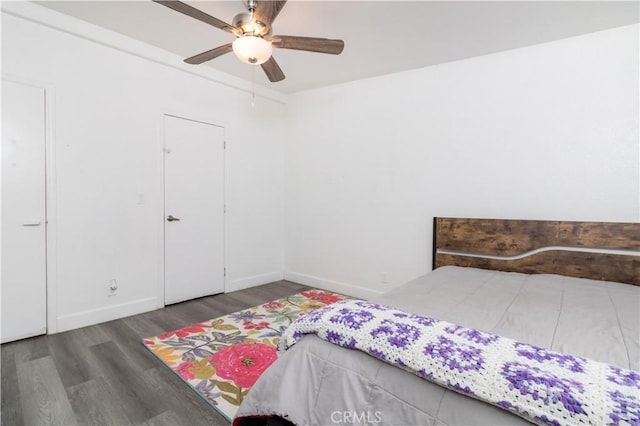 51490 Forest Boundry Rd, Anza, CA 92539 - bedroom with ceiling fan and dark wood-type flooring