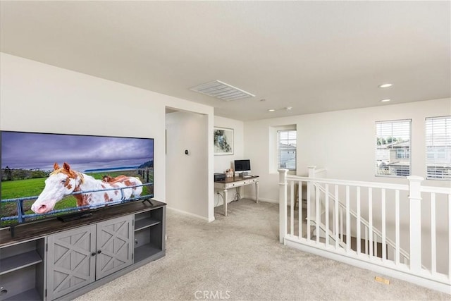 interior space featuring recessed lighting, light colored carpet, visible vents, and baseboards