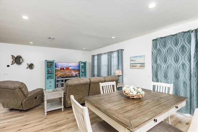 dining area featuring recessed lighting, light wood-style flooring, and visible vents