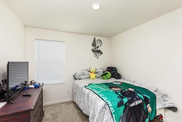 bedroom featuring baseboards and carpet floors