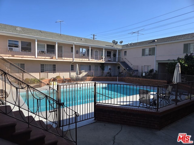 view of swimming pool with a patio