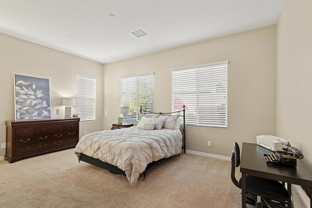 bedroom with light carpet