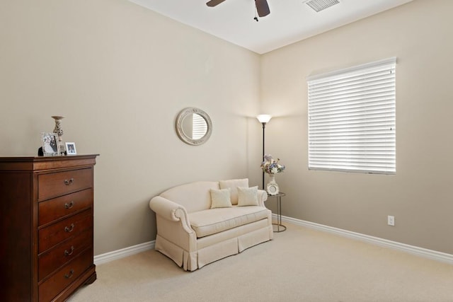 sitting room with light carpet and ceiling fan