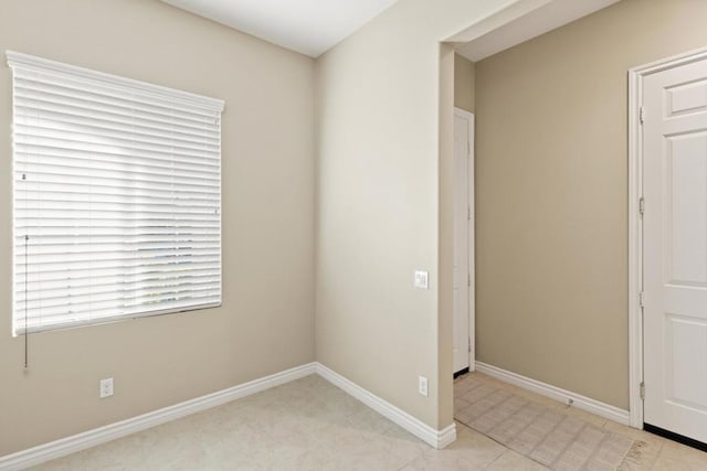 spare room with light tile patterned floors