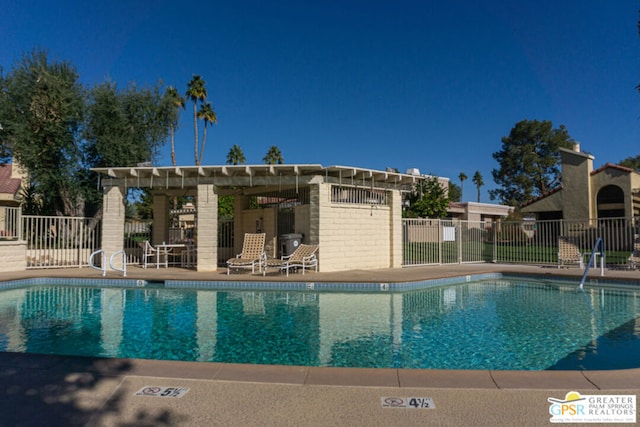 view of pool featuring a pergola and a patio area