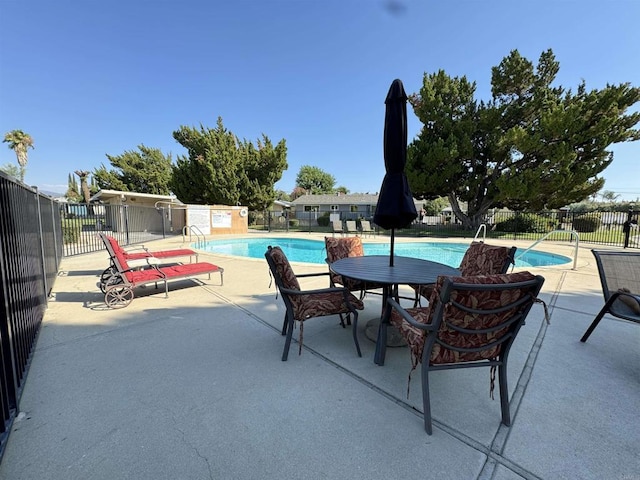 view of swimming pool featuring a patio area