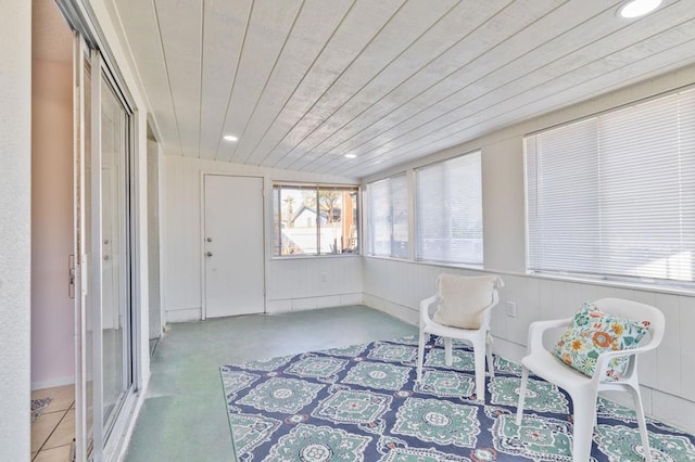 sunroom / solarium featuring wood ceiling